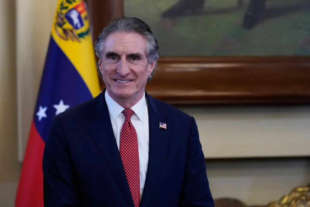 U.S. Interior Secretary Doug Burgum smiles during a meeting with Venezuela's acting President Delcy Rodriguez at Miraflores presidential palace in Caracas, Venezuela, Wednesday, March 4, 2026. (AP Photo/Ariana Cubillos)