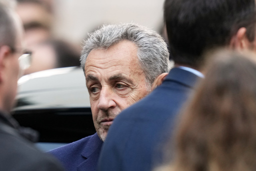 Former French President Nicolas Sarkozy reacts before entering a police car Tuesday, Oct. 21, 2025 in Paris as he heads to prison to serve time for a criminal conspiracy to finance his 2007 election campaign with funds from Libya. (AP Photo/Thibault Camus) Former French President Nicolas Sarkozy reacts before entering a police car Tuesday, Oct. 21, 2025 in Paris as he heads to prison to serve time for a criminal conspiracy to finance his 2007 election campaign with funds from Libya. (AP Photo/Thibault Camus)