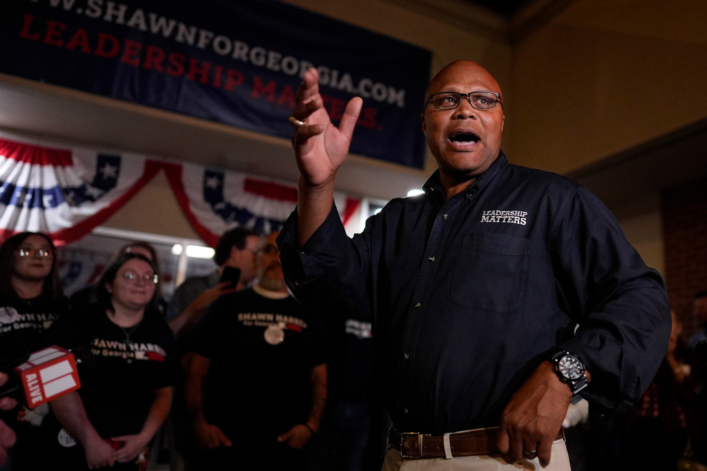 Democrat Shawn Harris speaks to supporters after learning he would advance to a runoff election against Republican Clay Fuller during an election night watch party, Tuesday, March 10, 2026, in Rome, Ga. (AP Photo/Mike Stewart)