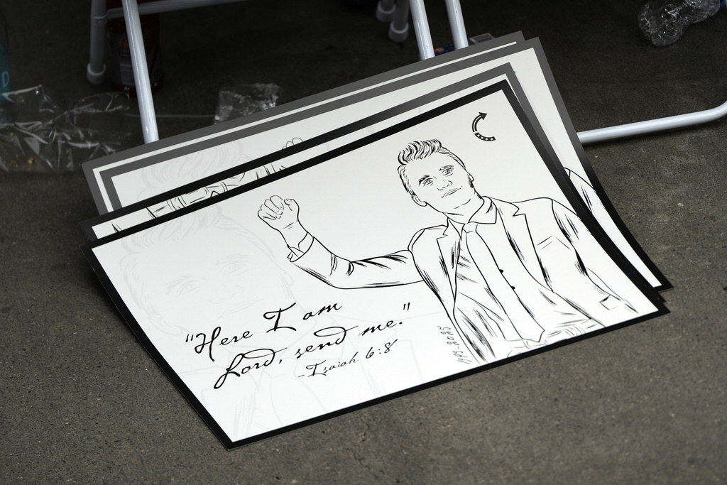 A poster depicting conservative activist Charlie Kirk is pictured at Kirk's memorial, Sunday, Sept. 21, 2025, at State Farm Stadium in Glendale, Ariz. (AP Photo/Julia Demaree Nikhinson)