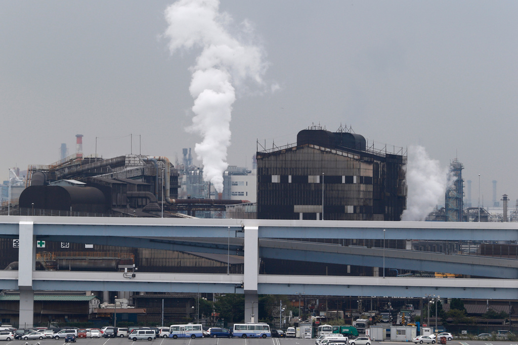 FILE - In this Oct. 21, 2013, file photo, smoke billows from an oil refinery in Kawasaki, southwest of Tokyo. (AP Photo/Koji Sasahara, File)