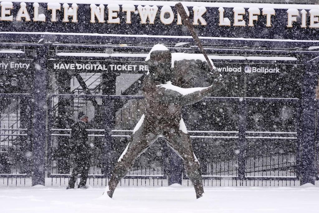 A man walks past a statue of Pittsburgh Pirates baseball Hall of Fame Willie Stargell outside PNC Park on the Northside of Pittsburgh at mid-morning Sunday, Jan. 25, 2026. (AP Photo/Gene J. Puskar)