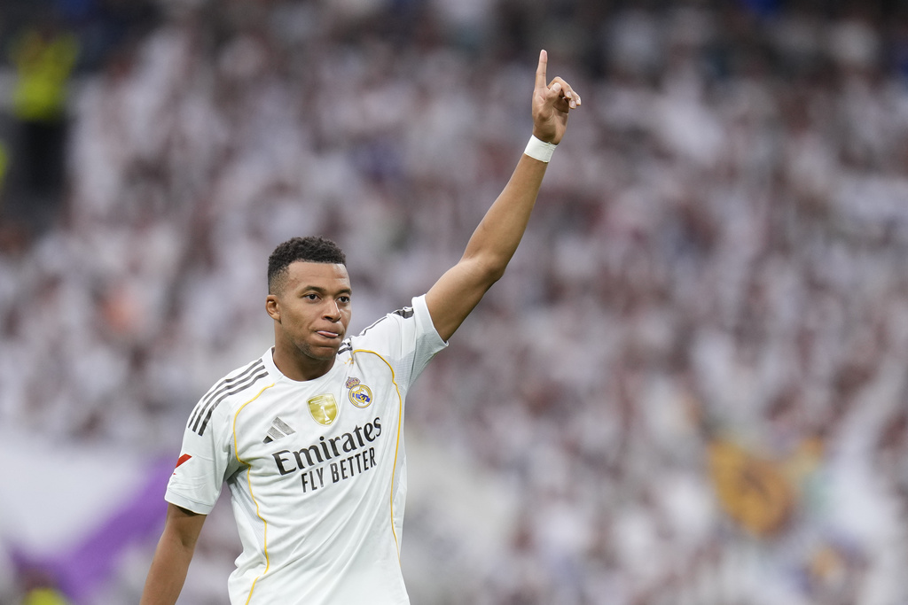 Real Madrid's Kylian Mbappe celebrates after scoring his side's second goal during the Spanish La Liga soccer match between Real Madrid and Espanyol at the Santiago Bernabeu stadium in Madrid, Spain, Saturday, Sept. 20, 2025. (AP Photo/Manu Fernandez)