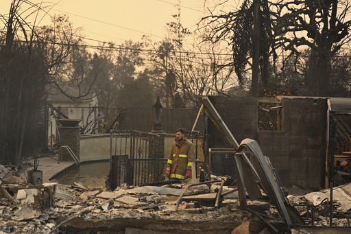 Robert Lara looks through his home that was destroyed after the Eaton Fire burns in Altadena, Calif., Thursday, Jan. 9, 2025. (AP Photo/Nic Coury) Robert Lara looks through his home that was destroyed after the Eaton Fire burns in Altadena, Calif., Thursday, Jan. 9, 2025. (AP Photo/Nic Coury)