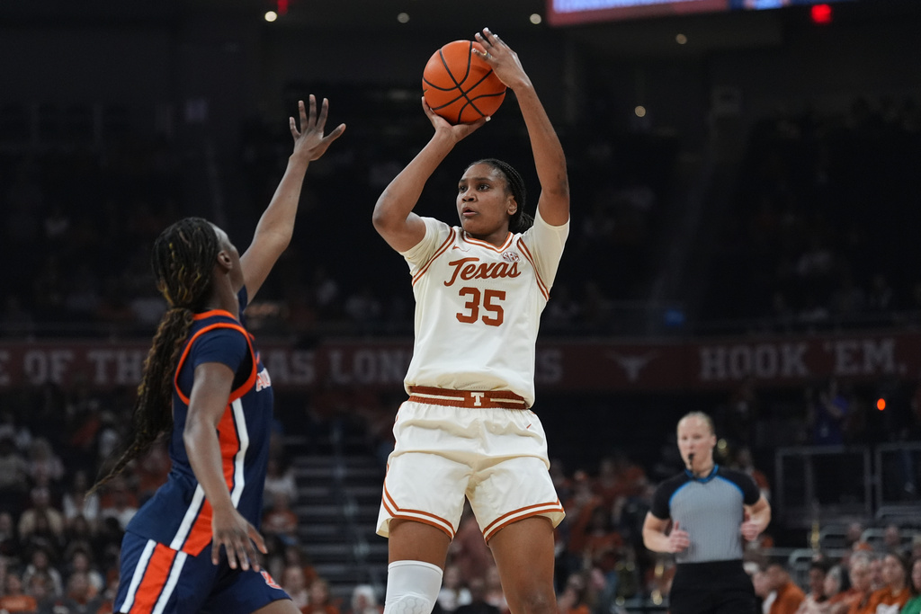 Texas forward Madison Booker (35) shoots over Auburn guard Harissoum Coulibaly (3) during the second half of an NCAA college basketball game in Austin, Texas, Thursday, Jan. 8, 2026. (AP Photo/Eric Gay)