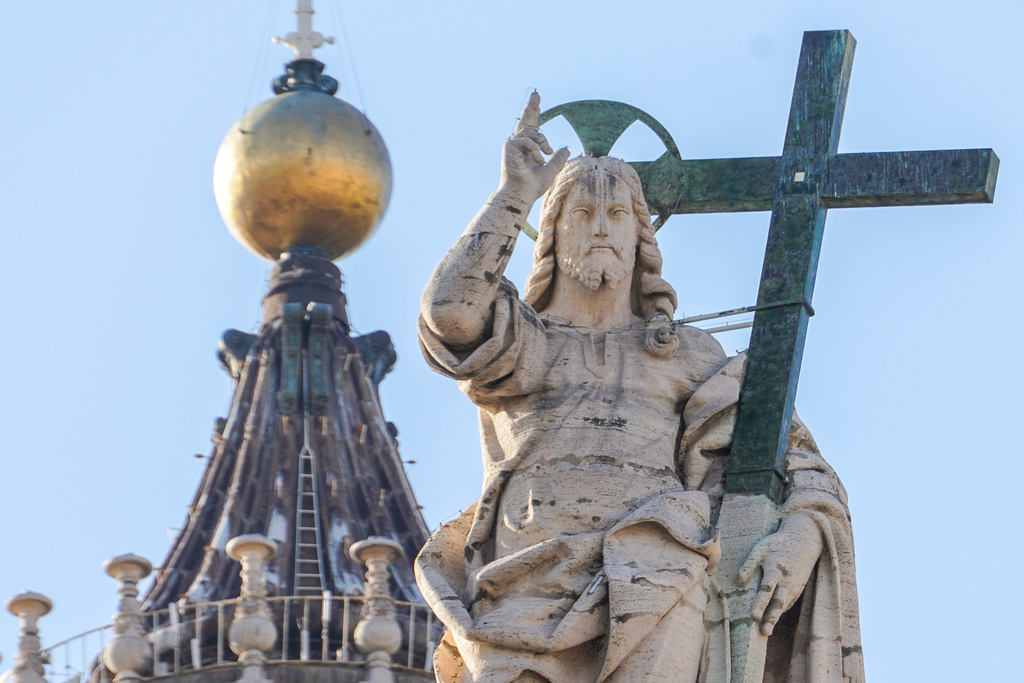 FILE - A statue of Jesus Christ on the facade of St. Peter's Basilica at the Vatican, Nov. 10, 2020. (AP Photo/Andrew Medichini, File)