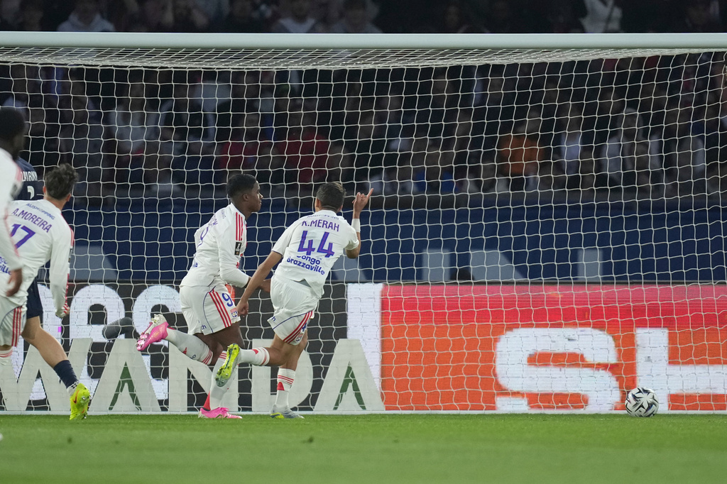 Lyon's Endrick, second from right, celebrates after scoring the opening goal during the French League One soccer match between Paris Saint-Germain and Olympique Lyon in Paris, France, Sunday, April 19, 2026. (AP Photo/Christophe Ena)