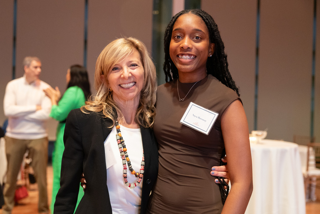 In this photo provided by National Education Equity Lab, Leslie Cornfeld, left, founder of the National Education Equity Lab, stands with Howard University alum Naysa Harraway at an Equity Lab event in New York, 2023. (National Education Equity Lab)
