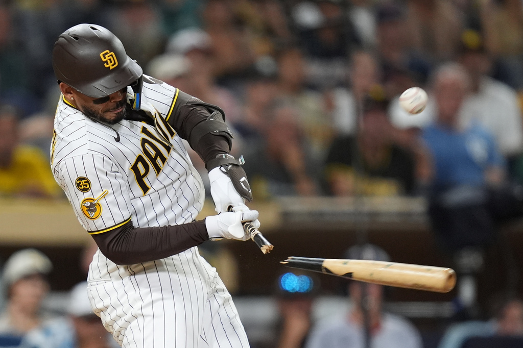 San Diego Padres' Luis Campusano breaks his bat as he hits an RBI single during the eighth inning of a baseball game against the Washington Nationals Tuesday, Sept. 8, 2026, in San Diego. (AP Photo/Gregory Bull)