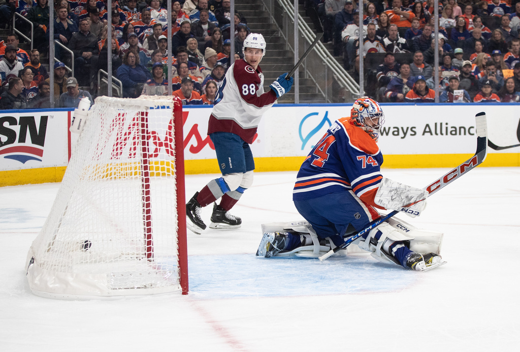 Colorado Avalanche's Martin Necas (88) watches the puck go in past Edmonton Oilers goalie Stuart Skinner (74) during first period of an NHL game in Edmonton on Saturday, Nov. 8, 2025. (Jason Franson/The Canadian Press via AP)