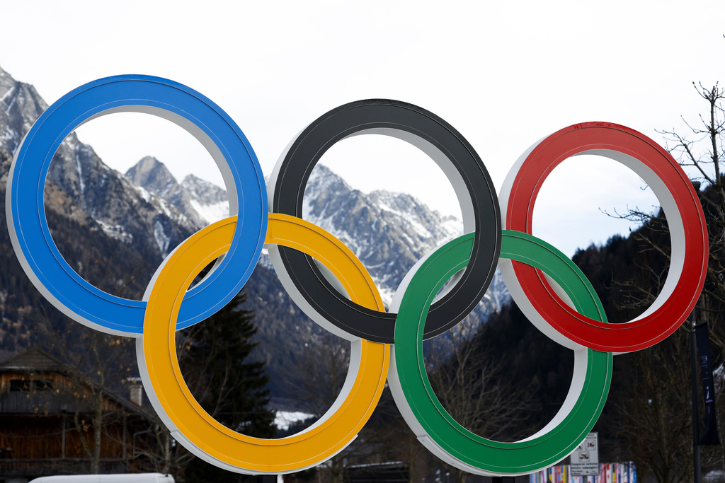 FILE - Olympic rings are seen near the village of Anterselva where the biathlon discipline will take place during the Milan Cortina 2026 Winter Olympics, in northern Italy, Saturday, Jan. 25, 2025. (AP Photo/Alessandro Trovati, File)