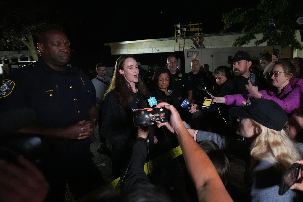 Seattle Mayor Katie Wilson, center, speaks at a news conference after a shooting at the Bite of Seattle food festival Sunday, July 26, 2026, in Seattle, Wash. (AP Photo/Lindsey Wasson)