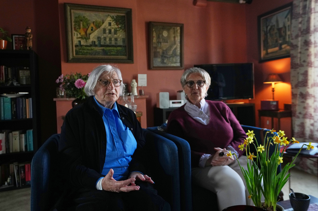 Brigitte Beernaert, left, and Jo Verplaetsen speak during an interview in a house inside the Beguinage Ten Wijngaerde in Bruges, Belgium, Wednesday, April 15, 2026. (AP Photo/Virginia Mayo)