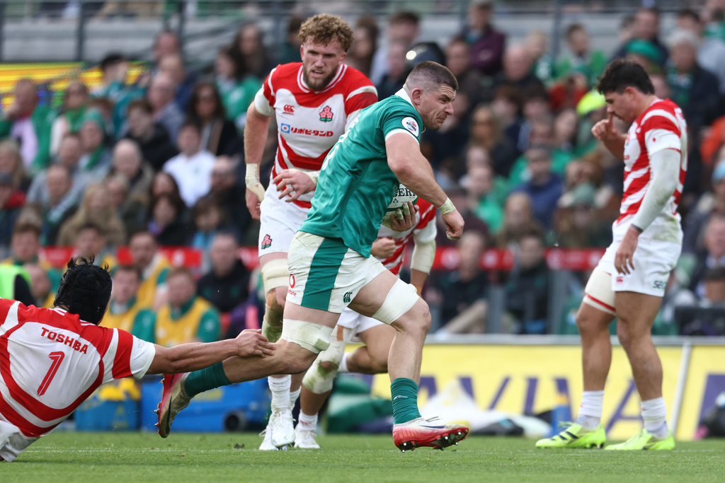 Ireland's Nick Timoney breaks through to score a try during the rugby union Nations Series match between Ireland and Japan in Dublin, Saturday, Nov. 8, 2025 . (AP Photo/Peter Morrison)