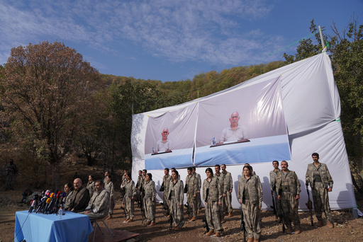 Kurdistan Workers' Party (PKK) fighters, who reportedly withdrew from Turkey with their weapons, stand to attention during a ceremony in the Qandil area of northern, Iraq, Sunday, Oct 26, 2025. (AP Photo/Rashid Yahya) Kurdistan Workers' Party (PKK) fighters, who reportedly withdrew from Turkey with their weapons, stand to attention during a ceremony in the Qandil area of northern, Iraq, Sunday, Oct 26, 2025. (AP Photo/Rashid Yahya)