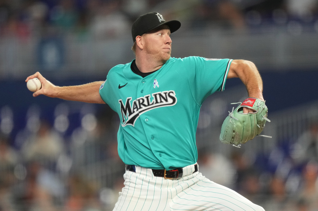 Miami Marlins starting pitcher Ryan Gusto throws during the first inning of a baseball game against the San Francisco Giants, Sunday, June 21, 2026, in Miami. (AP Photo/Jim Rassol)
