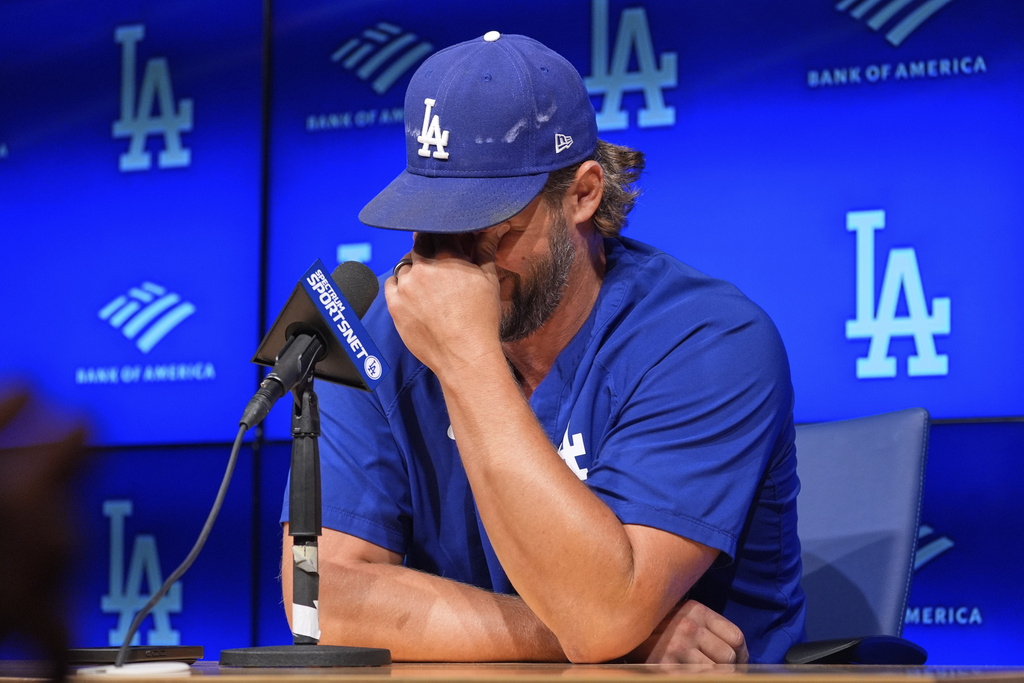Los Angeles Dodgers pitcher Clayton Kershaw wipes his eyes as he speaks to the media after announcing his retirement at the end of the season prior to a baseball game against the San Francisco Giants Thursday, Sept. 18, 2025, in Los Angeles. (AP Photo/Mark J. Terrill)