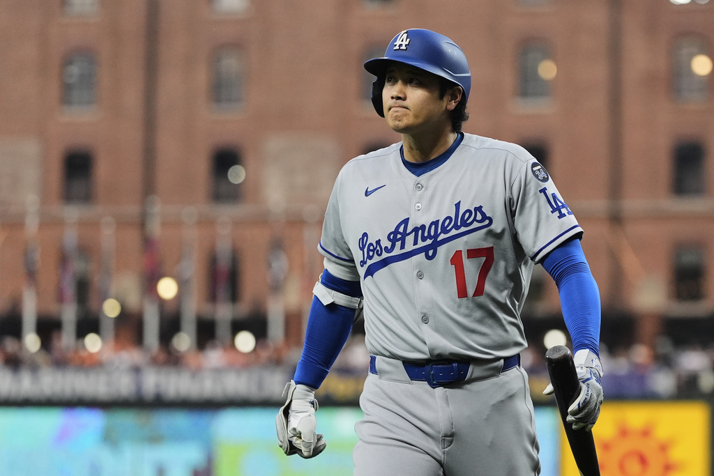 Los Angeles Dodgers' Shohei Ohtani reacts after striking out swinging during the first inning of a baseball game against the Baltimore Orioles, Friday, Sept. 5, 2025, in Baltimore. (AP Photo/Stephanie Scarbrough)