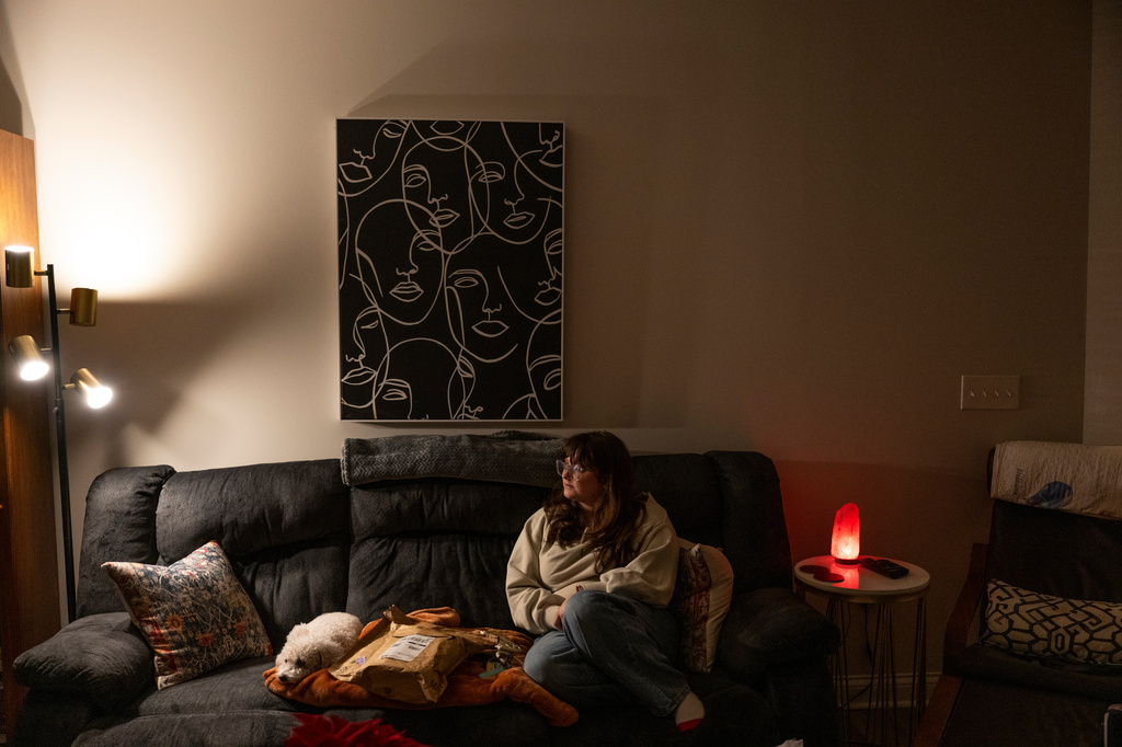 Kate poses for a portrait in her apartment in Kentucky, Wednesday, Dec. 10, 2025. (AP Photo/Michael Swensen)