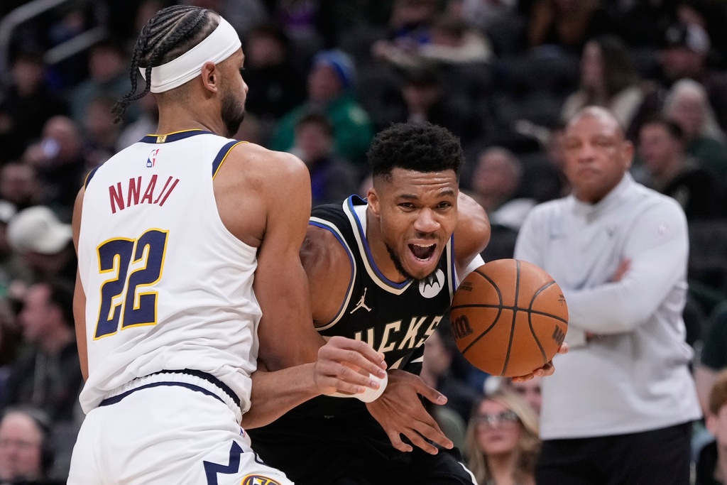 Milwaukee Bucks' Giannis Antetokounmpo tries to get past Denver Nuggets' Zeke Nnaji during the second half of an NBA basketball game Friday, Jan. 23, 2026, in Milwaukee. (AP Photo/Morry Gash)