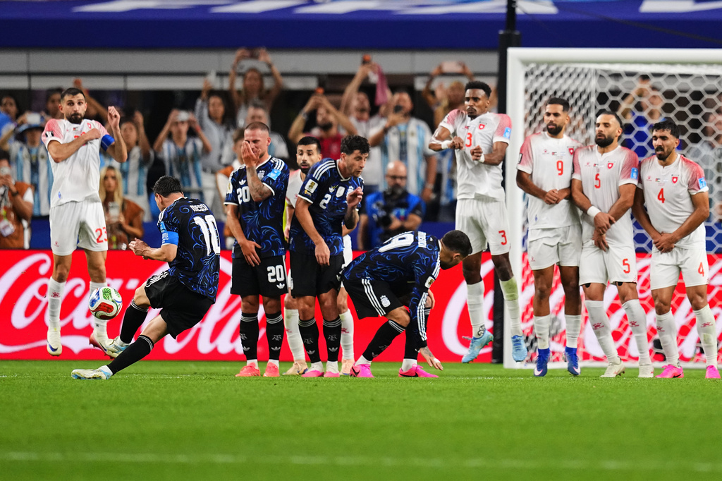 Argentina's Lionel Messi, second from left, scores his side's third goal on a free kick during the World Cup Group J soccer match against Jordan in Arlington, Texas, near Dallas, Saturday, June 27, 2026. (AP Photo/Julio Cortez)