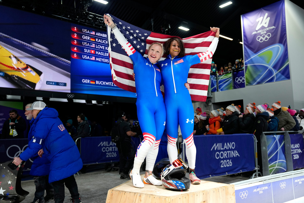 United States' Kaillie Armbruster Humphries, left, and Jasmine Jones arrive at the finish during a two women bobsled run at the 2026 Winter Olympics, in Cortina d'Ampezzo, Italy, Saturday, Feb. 21, 2026. (AP Photo/Alessandra Tarantino)