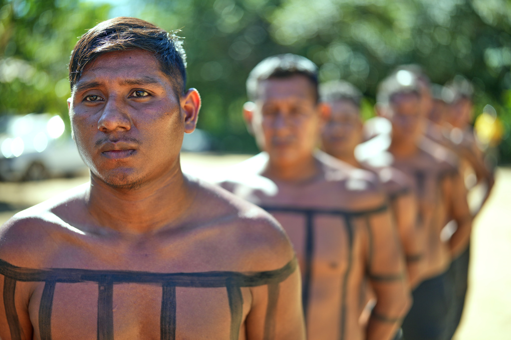 Xerente Indigenous firefighters stand during a fire prevention operation along Brazil's environmental protection agency, IBAMA, at the Xerente territory, near Tocantinia, Tocantins state, Brazil, Tuesday, May 19, 2026. (AP Photo/Andre Penner)