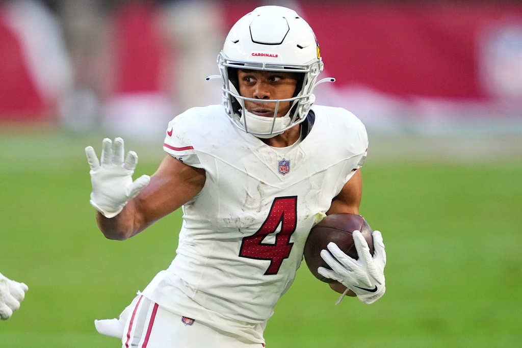 FILE - Arizona Cardinals wide receiver Rondale Moore (4) runs against the San Francisco 49ers during the first half of an NFL football game, Dec. 17, 2023, in Glendale, Ariz. (AP Photo/Matt York, File)