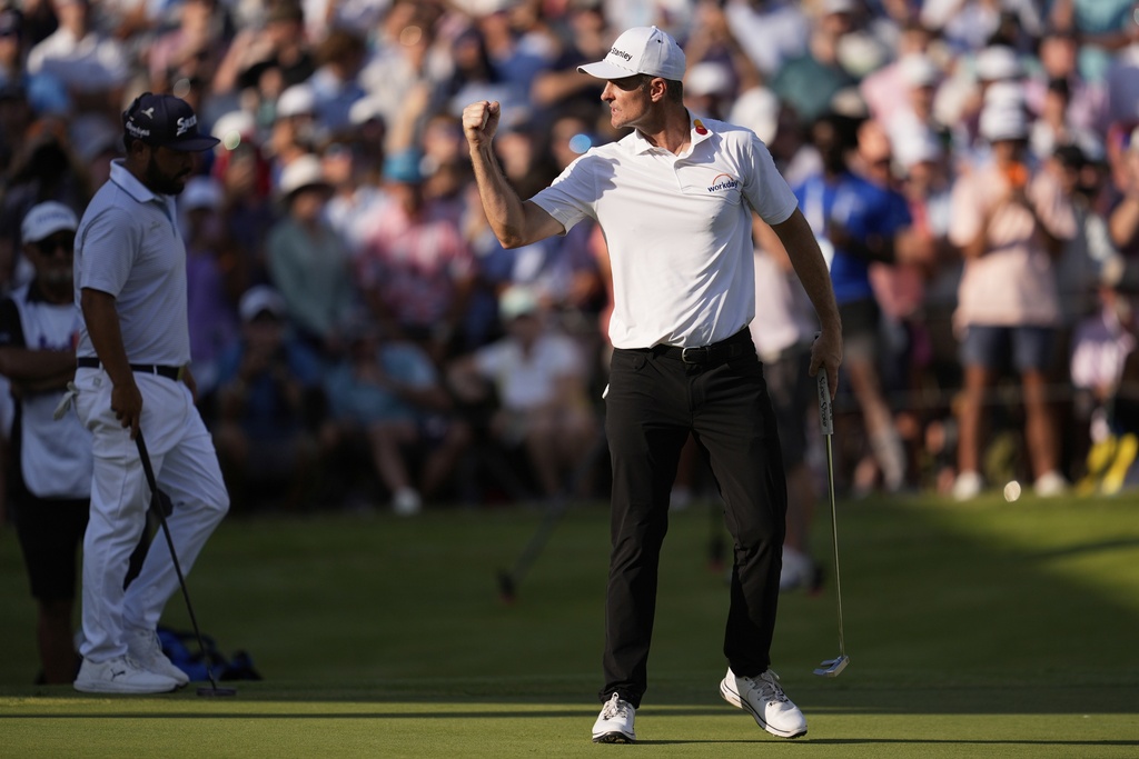 Justin Rose, of England, reacts after winning on the third playoff hole at the St. Jude Championship golf tournament Sunday, Aug. 10, 2025, in Memphis, Tenn. (AP Photo/George Walker IV)