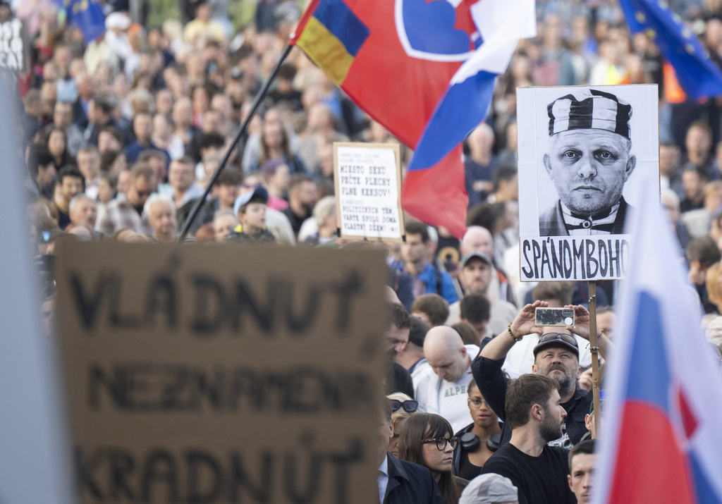 People attend a public protest against government's announced consolidation measures for next year organised by the opposition Progressive Slovakia (PS) party in Bratislava, Slovakia, Tuesday Sept. 16, 2025. (Martin Baumann/TASR via AP)