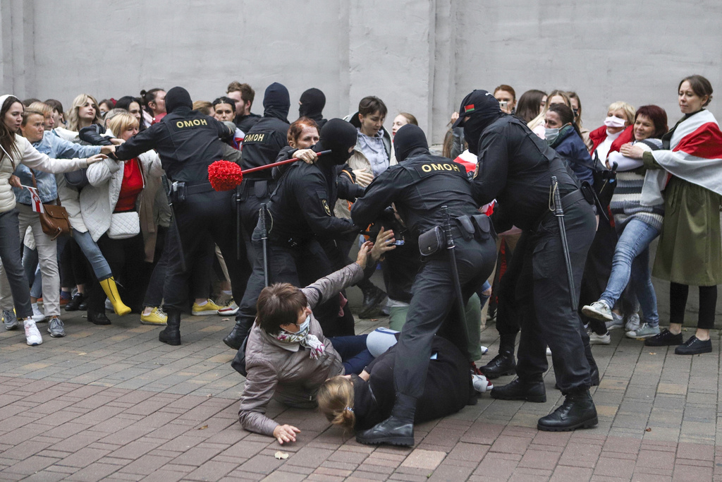 FILE - Police officers detain protesters during a rally in Minsk, Belarus, on Sept. 8, 2020, in support of opposition figure Maria Kolesnikova following a disputed presidential election the previous month. (AP Photo, File)