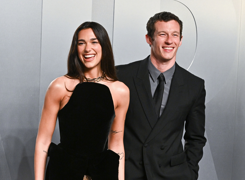 FILE - Dua Lipa, left, and Callum Turner arrive at the Vanity Fair Oscar Party on Sunday, March 15, 2026, at the Los Angeles County Museum of Art in Los Angeles. (Photo by Evan Agostini/Invision/AP, File)