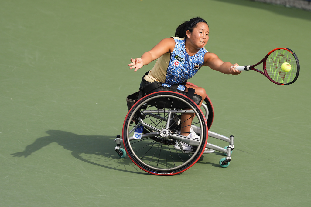 Yui Kamiji, of Japan, returns a shot to Diede De Groot, of the Netherlands, during the second round of the wheelchair men's singles of the U.S. Open tennis championships, Thursday, Sept. 4, 2025, in New York. (AP Photo/Yuki Iwamura)