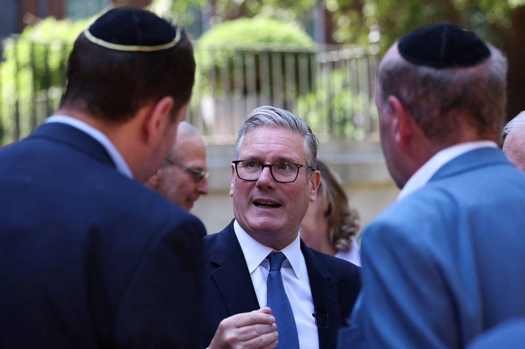 Britain's Prime Minister Keir Starmer, center, hosts a reception with the Jewish community, to discuss efforts to tackle antisemitism, at Downing Street in London, England, Monday, July 13, 2026. (Suzanne Plunkett/Pool Photo via AP)