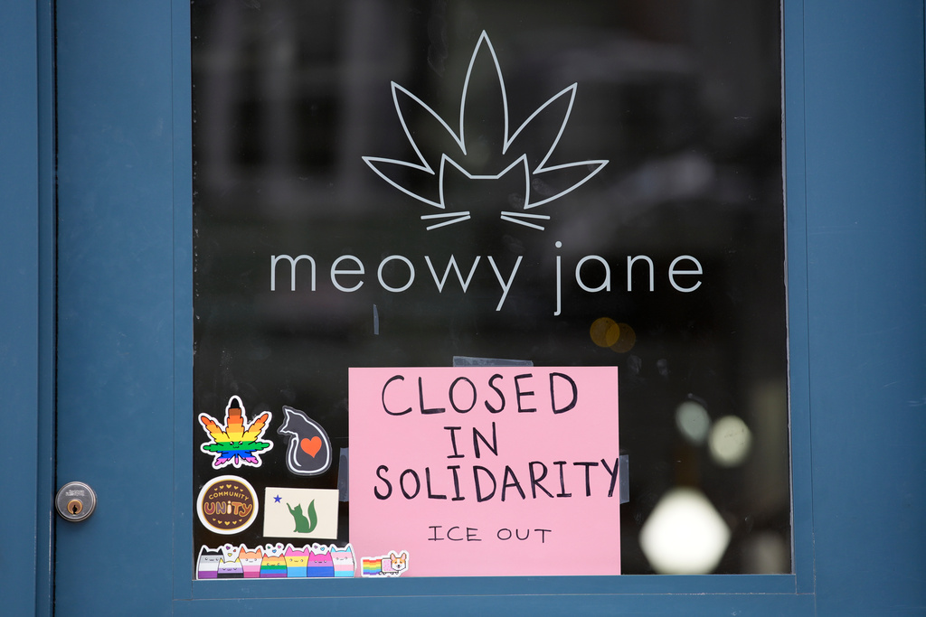 A sign at a cannabis shop indicates it is closed for the general strike to support the state's immigrant community Friday, Jan. 30, 2026, in Portland, Maine. (AP Photo/Robert F. Bukaty)