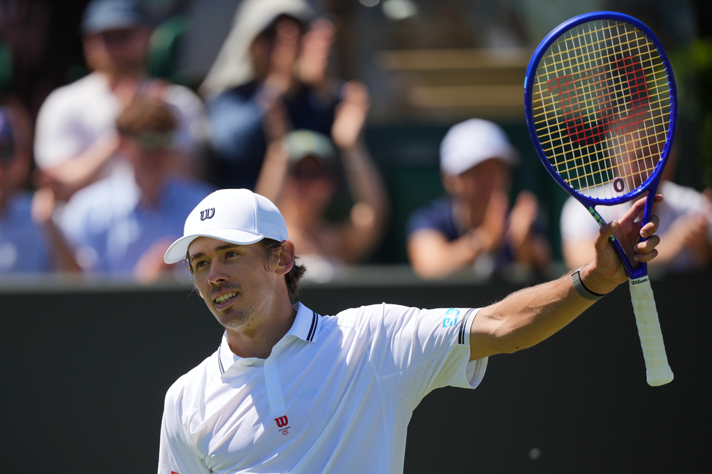 Alex de Minaur of Australia celebrates winning the second round men's singles match against Adrian Mannarino of France at the Wimbledon Tennis Championships in London, Thursday, July 2, 2026.(AP Photo/Kin Cheung)