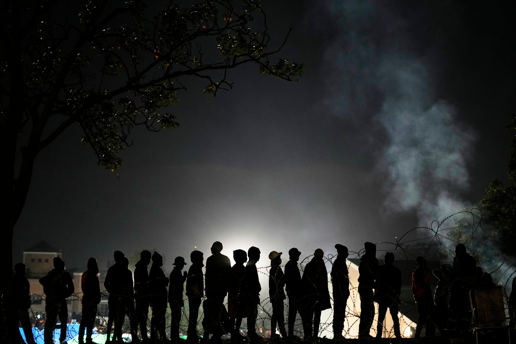 Malawian migrants stand in a queue for their deportation at a temporary centre, in Durban, South Africa, Thursday, June 18, 2026. (AP Photo/Themba Hadebe)
