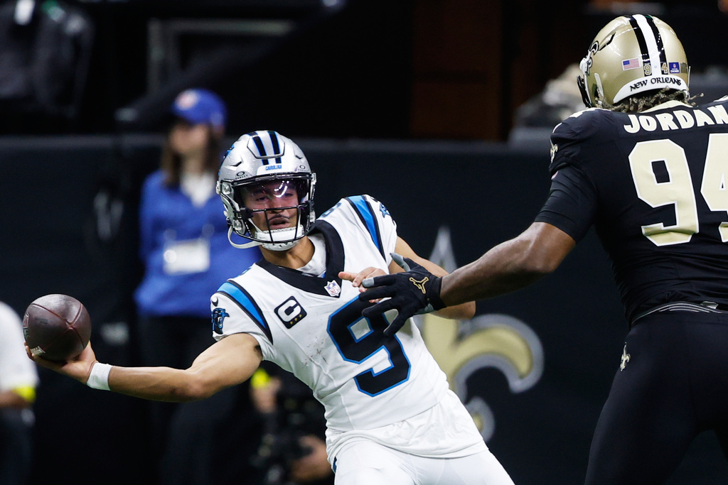 Carolina Panthers quarterback Bryce Young (9) completes a pass in the first half of an NFL football game against the New Orleans Saints, Sunday, Dec. 14, 2025, in New Orleans. (AP Photo/Butch Dill)
