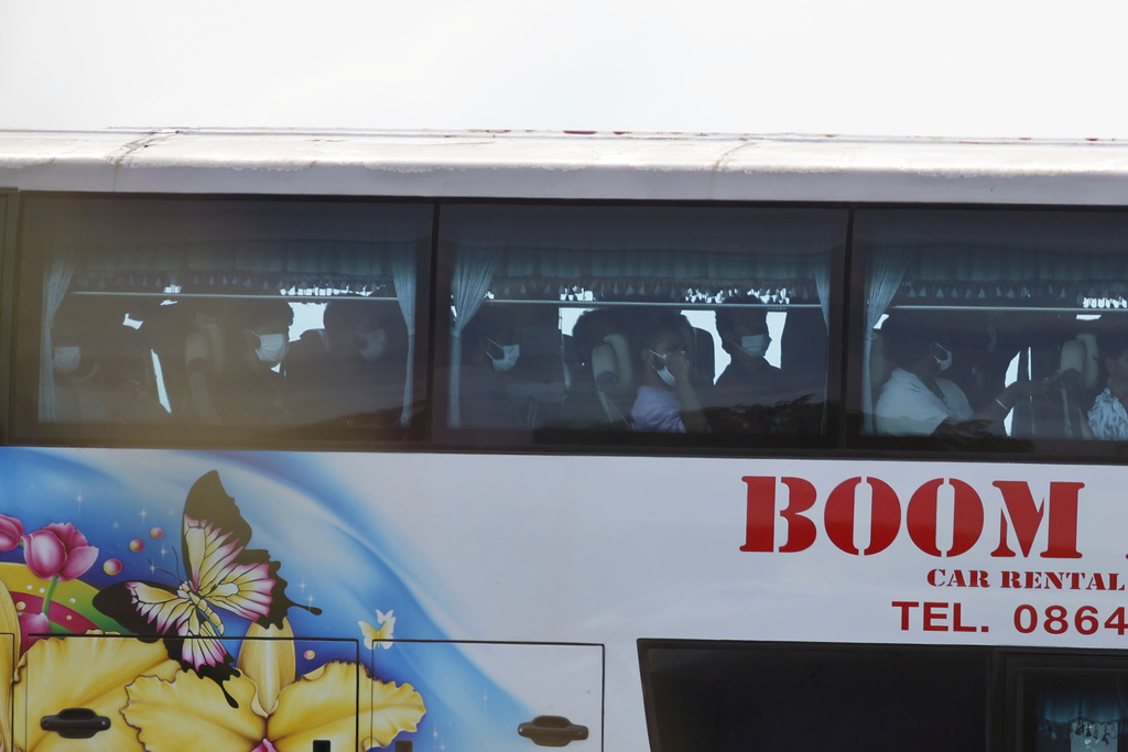 A bus, believed to be carrying India nationals who have worked at scam center in Myanmar, crosses the 2nd Thai-Myanmar Friendship Bridge in Mae Sot in Thailand's Tak province before being flown back to India, Thursday, Nov. 6, 2025. (AP Photo/Sarot Meksophawannakul)