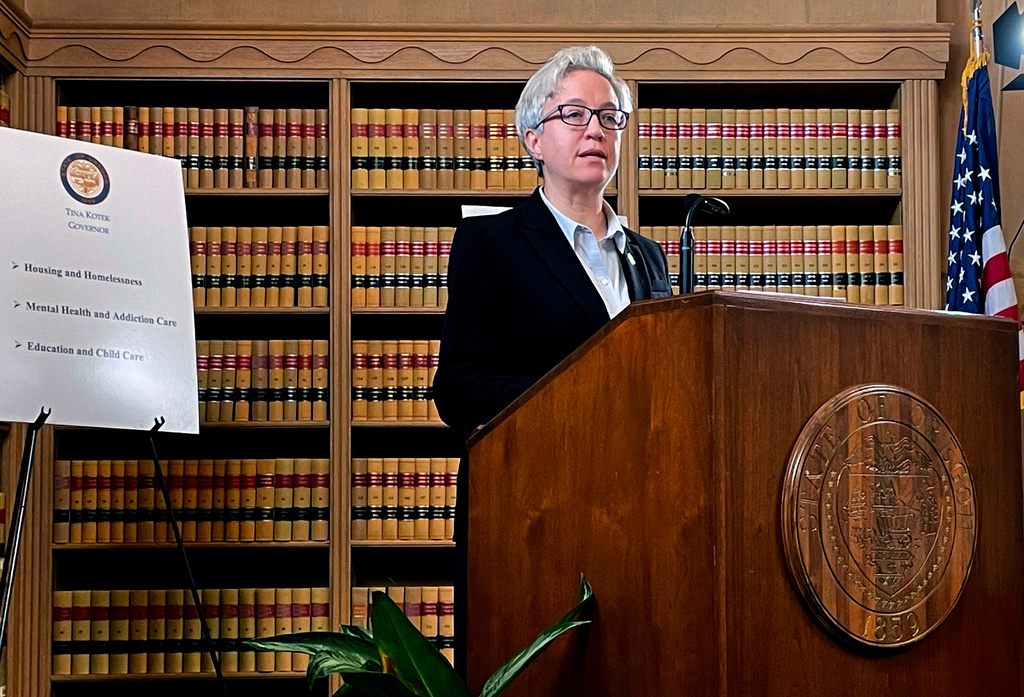 FILE - Newly inaugurated Oregon Gov. Tina Kotek unveils her first budget proposal as governor at the State Library of Oregon in Salem on Jan. 31, 2023. (AP Photo/Claire Rush, File)
