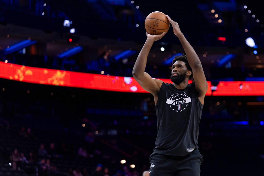 Philadelphia 76ers' Joel Embiid shoots some warm up shots prior to an NBA basketball game against the Atlanta Hawks, Sunday, Nov. 30, 2025, in Philadelphia. (AP Photo/Chris Szagola)