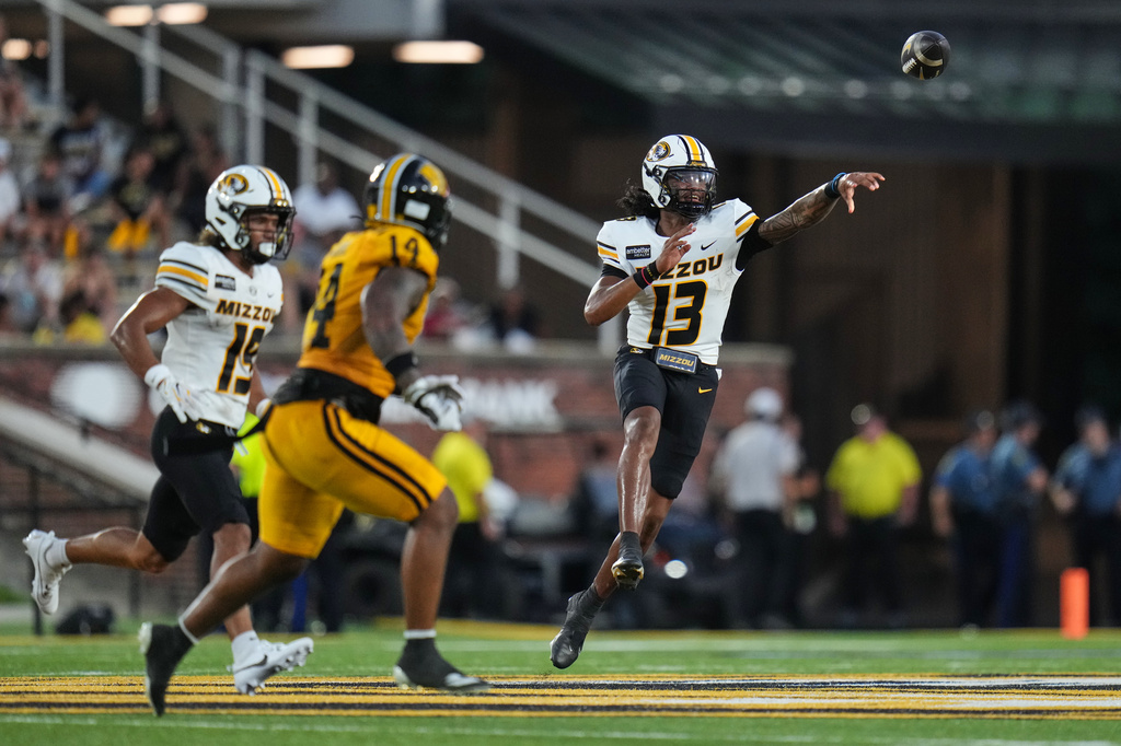 Missouri quarterback Austin Simmons (13) throws during the first half of an NCAA college football game against Arkansas-Pine Bluff Thursday, Sept. 3, 2026, in Columbia, Mo. (AP Photo/Jeff Roberson)
