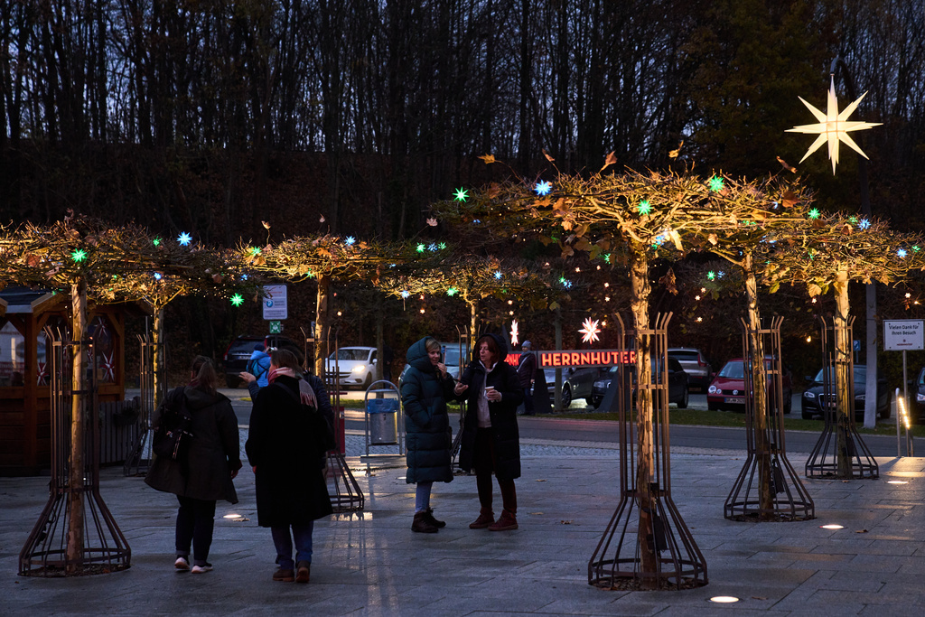 People visit Herrnhuter Sterne GmbH manufacturing, a Christmas stars manufacturing company in Herrnhut, Germany, Nov. 10, 2025. (AP Photo/Ebrahim Noroozi)