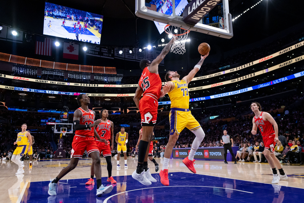 Los Angeles Lakers guard Luka Doncic (77) goes to the basket during the first half of an NBA basketball game against the Chicago Bulls, Thursday, March 12, 2026, in Los Angeles. (AP Photo/Ethan Swope)