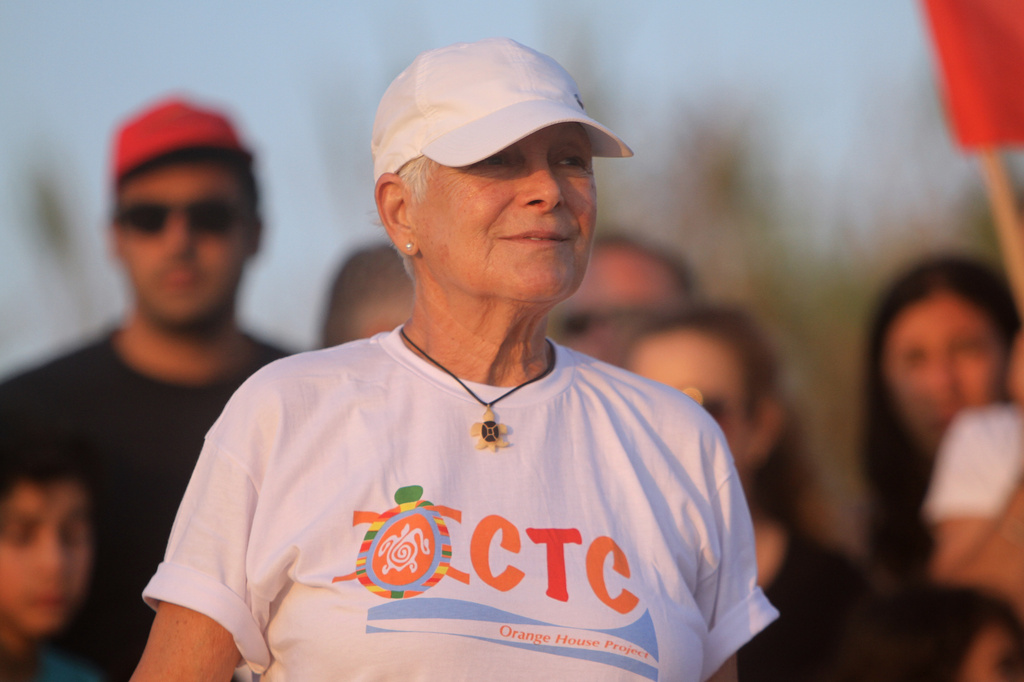 Mona Khalil, a Lebanese conservationist who died on Friday after being wounded in an Israeli strike on her home on Lebanon's southern coast, attends an event of releasing baby sea turtles in Mansouri village near Tyre city, south Lebanon, July 31, 2019. (AP Photo/Hussein Malla)