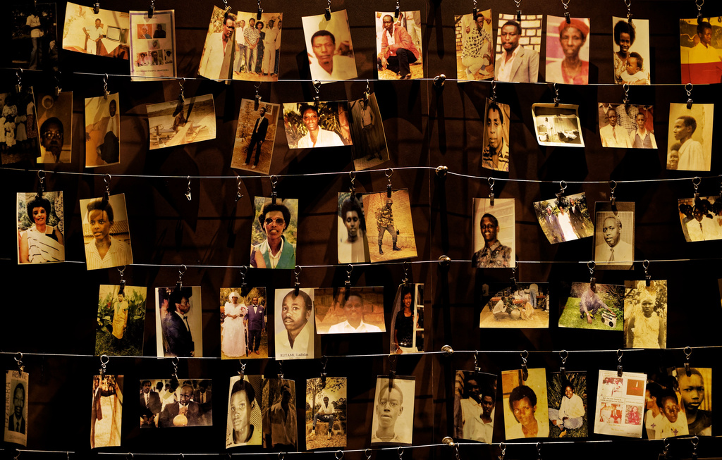 FILE - Family photographs of people killed in the Rwandan genocide are on display at the Kigali Genocide Memorial center in Kigali, Rwanda, on April 5, 2019. (AP Photo/Ben Curtis, File)