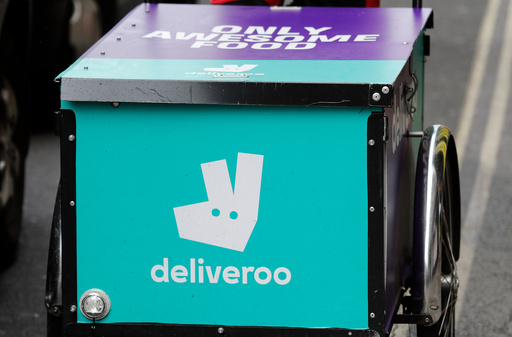 FILE - This July 11, 2017 file photo, shows a deliveroo logo on a bicycle in London. (AP Photo/Frank Augstein, File) FILE - This July 11, 2017 file photo, shows a deliveroo logo on a bicycle in London. (AP Photo/Frank Augstein, File)
