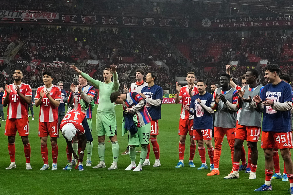 Bayern's goalkeeper Manuel Neuer celebrates with team mates after the German Soccer Cup semifinal match between Bayer Leverkusen and Bayern Munich in Leverkusen, Germany, Wednesday, April 22, 2026. (AP Photo/Martin Meissner)
