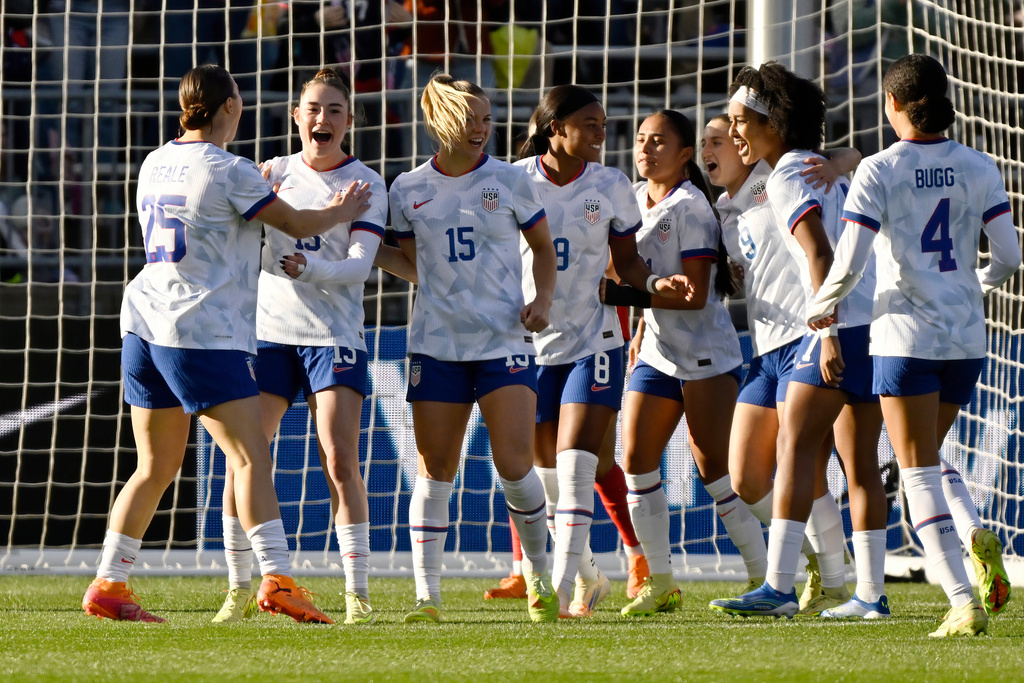 United States' Olivia Moultrie, second from left, celebrates with teammates after her goal during the first half of an international friendly women's soccer match against Portugal, Sunday, Oct. 26, 2025, in East Hartford, Conn. (AP Photo/Jessica Hill)