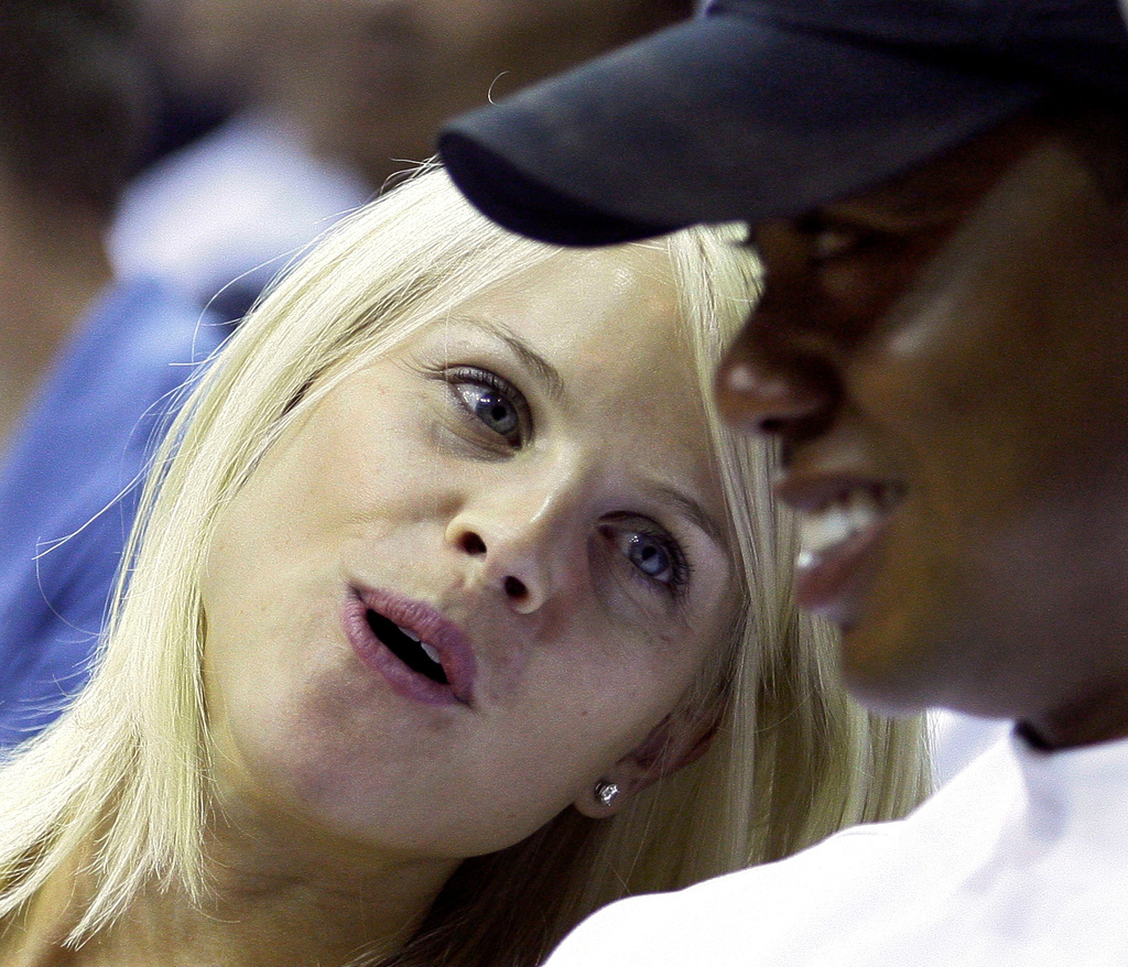 FILE - Elin Nordegren talks to her husband, golfer Tiger Woods, during the first quarter of Game 4 of the NBA basketball finals in Orlando, Fla., June 11, 2009. (AP Photo/David J. Phillip, File)